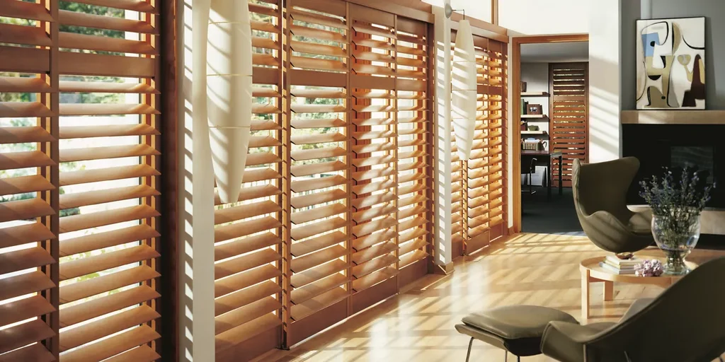 Custom hardwood blinds in a living room, from The Blind Biz
